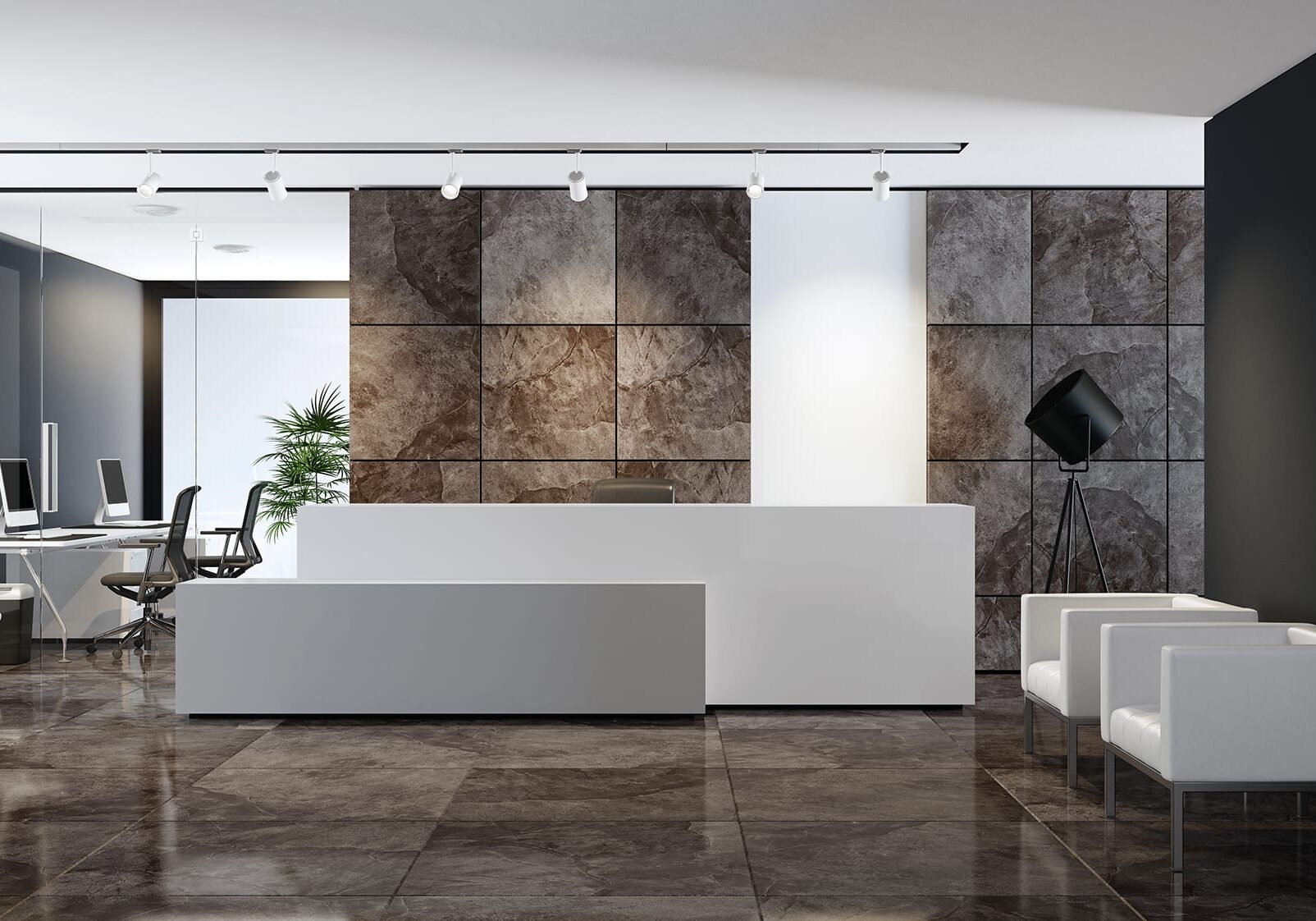 white reception desk with copy space in entrance area of an office building 
with natural slate stone large brown veneer tiles. lobby area with two white 
leather armchairs in front of black wall and two white computer desks. 
white ceiling with white spotlights