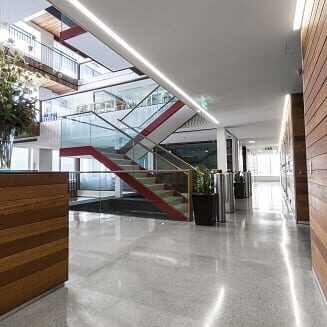 "Reception area in a modern, sophisticated &amp; brightly lit office space in a eco-friendly office building"